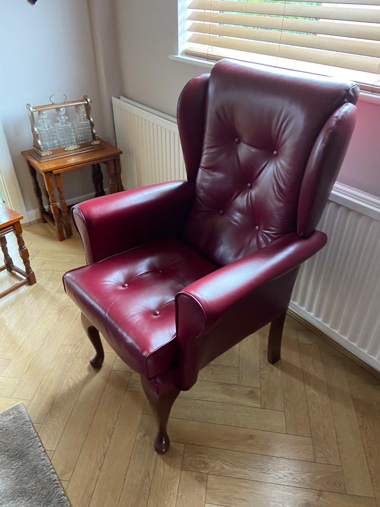 Wing chair in red leather